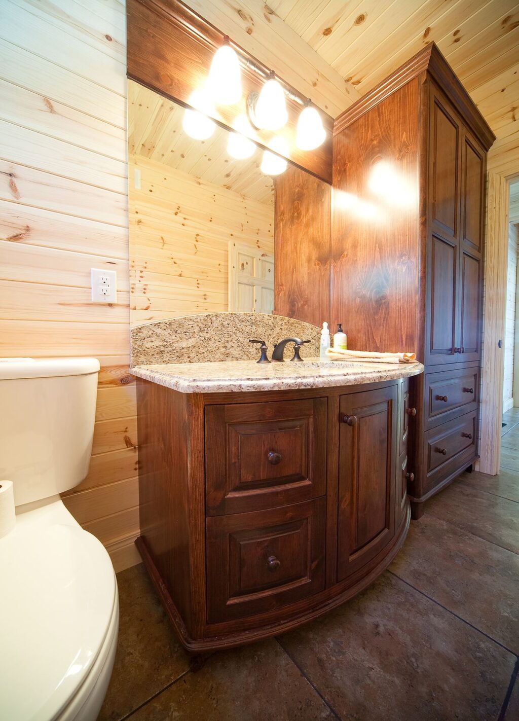 rustic bathroom with custom curved vanity