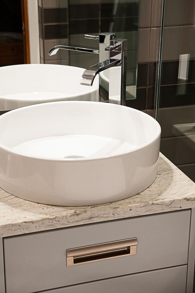 cylindrical vessel sink on custom bathroom vanity