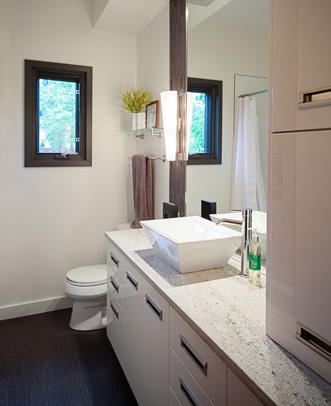 custom bathroom with stone countertops and square vessel sink