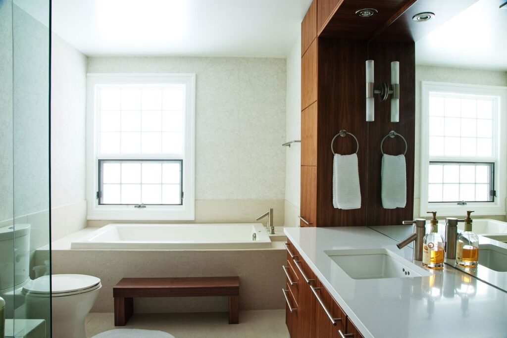 custom bathroom remodel with built-in bathtub and large vanity