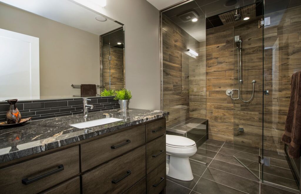 custom bathroom with steam shower and dark wood-look tiles