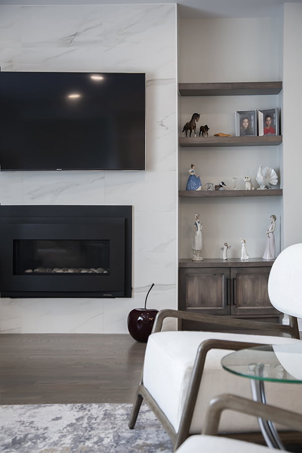 residential interior design and renovation custom modern fireplace with large tile and custom built-in cabinets