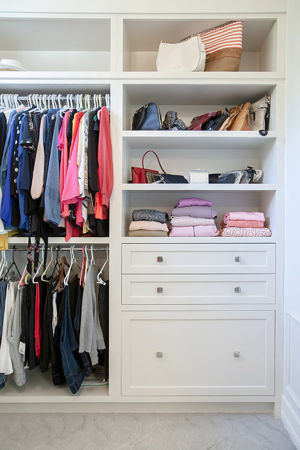 custom walk-in closet custom closet renovation with open shelves, drawers and double rods
