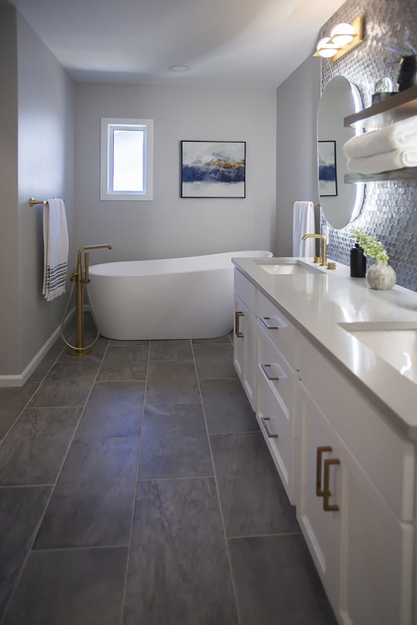 bathroom reno with large freestanding bathtub and double vanity