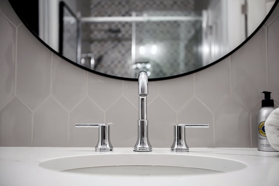 bathroom vanity with round undermount sink and chrome faucet