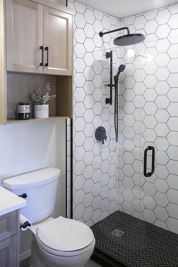 bathroom remodel with hexagonal tile and custom cabinets